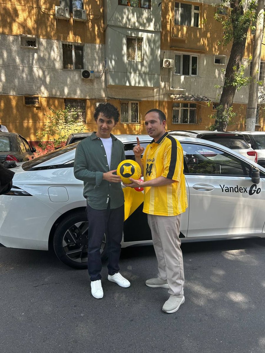 On set: a Yandex Go driver hands the ball of wishes to a young fan